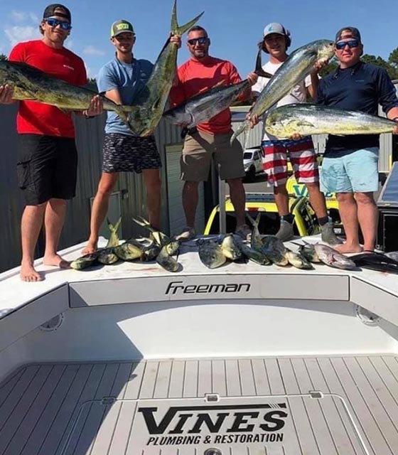 group of men with caught fish